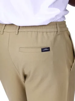 Pantalon chino beige uni avec une coupe ajustée à zip et à bouton
