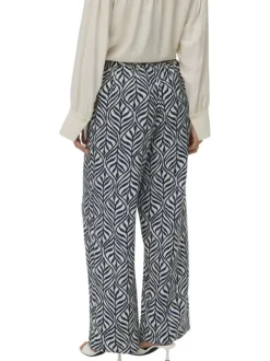 Pantalon chino bleu et blanc coupe ample orné d'un motif végétal