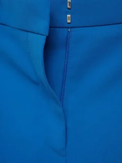 Pantalon Chino bleu uni avec une coupe bootcut et zippé boutonné à la taille