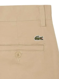 Pantalon chino en coton beige à coupe slim pourvu de poches plaquées