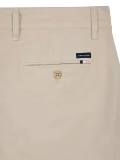 Pantalon chino en coton beige uni avec une coupe cigarette à zip et bouton