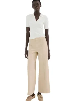 Pantalon chino en coton beige uni pourvu d'une coupe droite