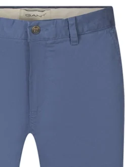 Pantalon chino en coton bleu uni avec une fermeture boutonnée et zippée