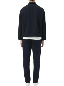 Pantalon chino en coton marine à coupe slim pourvu de poches plaquées