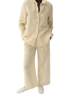 Pantalon chino en lin beige uni pourvu d'une coupe large et d'une taille haute
