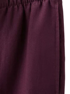 Pantalon chino en lin bordeaux uni pourvu d'une coupe large