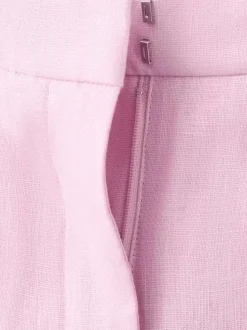 Pantalon chino en lin rose uni pourvu d'une taille intermédiaire