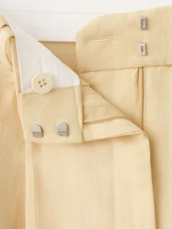 Pantalon chino jaune uni pourvu d'une coupe bootcut et d'une taille haute