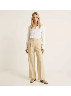 Pantalon chino jaune uni pourvu d'une coupe bootcut et d'une taille haute