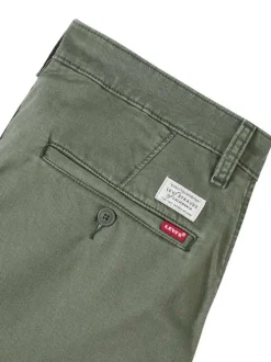 Pantalon chino kaki à coupe slim pourvu du patch de la marque