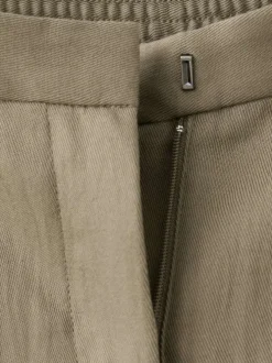 Pantalon chino kaki uni pourvu d'une coupe large et d'une taille haute