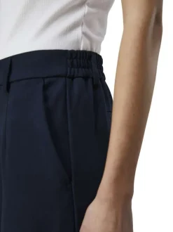 Pantalon chino marine uni pourvu d'une taille élastiquée et d'une coupe bootcut