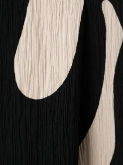 Pantalon chino noir à motifs pourvu d'une coupe droite et d'une taille haute