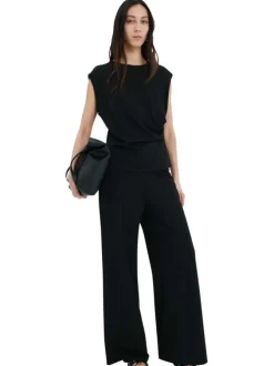 Pantalon chino noir uni pourvu d'une coupe bootcut et d'une taille haute