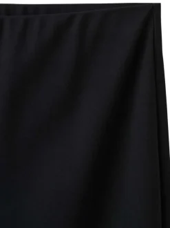 Pantalon chino noir uni pourvu d'une coupe bootcut et d'une taille haute