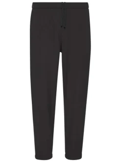 Pantalon chino noir uni pourvu d'une coupe slim et d'une taille elastiquée