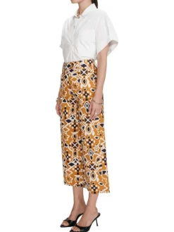 Pantalon chino orange en coton avec des motifs géométriques et une coupe flare