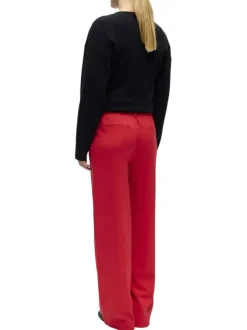 Pantalon chino rouge uni pourvu d'une coupe bootcut et d'une taille haute