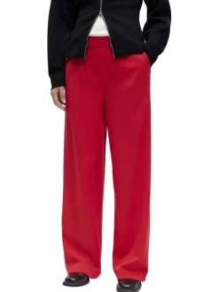 Pantalon chino rouge uni pourvu d'une coupe bootcut et d'une taille haute