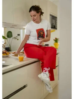 Pantalon chino rouge uni pourvu d'une coupe bootcut et d'une taille haute