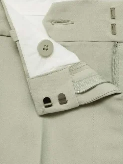 Pantalon Chino vert uni avec une coupe bootcut et zippé boutonné à la taille