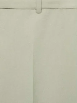 Pantalon Chino vert uni avec une coupe bootcut et zippé boutonné à la taille