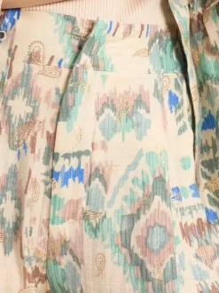 Pantalon écru pourvu de motifs aztec mulitcolores imprimés et d'une coupe large