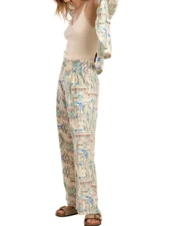 Pantalon écru pourvu de motifs aztec mulitcolores imprimés et d'une coupe large