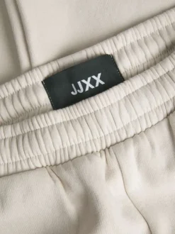 Pantalon de jogging en coton écru uni à coupe large et élastiqué aux chevilles
