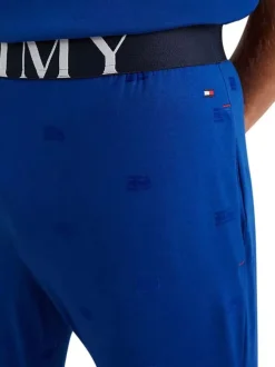 Pantalon de pyjama en coton biologique bleu avec une coupe droite et logo all-over