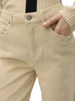 Pantalon en coton beige avec un revêtement effet velours à coupe droite