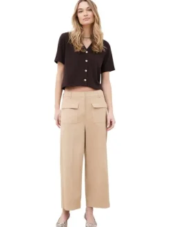 Pantalon en coton beige à coupe ample pourvu de poches à rabats