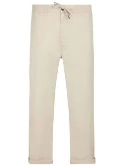Pantalon en coton beige à coupe droite pourvu d'une taille élastiquée