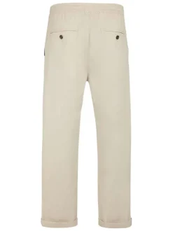 Pantalon en coton beige à coupe droite pourvu d'une taille élastiquée