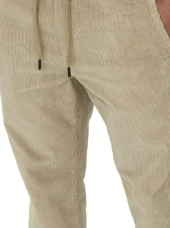 Pantalon en coton beige en velours côtelé à coupe regular fit