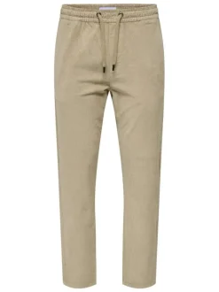 Pantalon en coton beige en velours côtelé à coupe regular fit