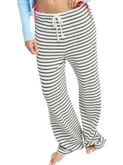 Pantalon en coton blanc et noir à coupe ample pourvu d'un cordon de serrage