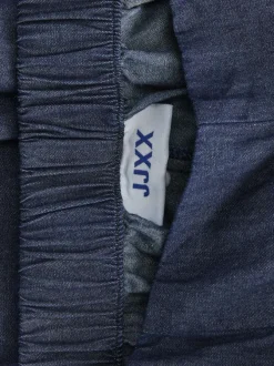 Pantalon en coton bleu pourvu d'une coupe évasée et d'une taille élastiquée