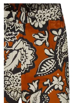 Pantalon en coton caramel imprimé de fleurs avec une coupe bootcut