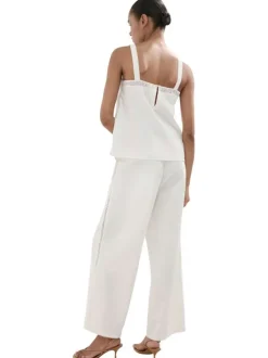 Pantalon en coton mélangé écru uni pourvu de détails brodés et ajourés