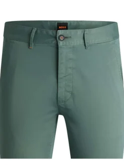 Pantalon en coton vert uni avec une coupe slim fit et des détails orange