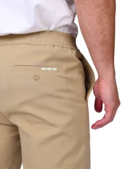 Pantalon jogging beige uni avec une coupe droite et une taille élastiquée