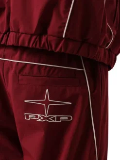 Pantalon jogging bordeaux uni pourvu d'une taille élastiquée