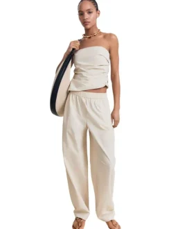 Pantalon jogging en coton écru uni avec une coupe droite et deux poches