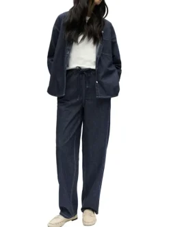 Pantalon jogging en coton indigo uni pourvu d'une coupe bootcut