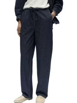 Pantalon jogging en coton indigo uni pourvu d'une coupe bootcut