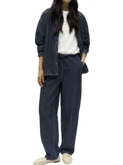 Pantalon jogging en coton indigo uni pourvu d'une coupe bootcut