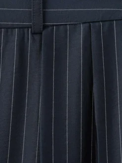 Pantalon marine à rayures blanches avec une coupe bootcut et 4 poches