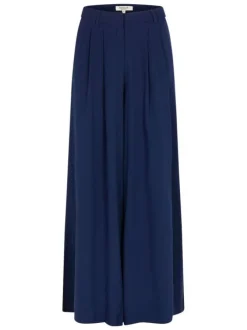Pantalon marine uni pourvu d'une coupe large et de détails plissés