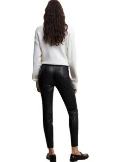 Pantalon noir uni avec une coupe skinny et un zip sur le côté